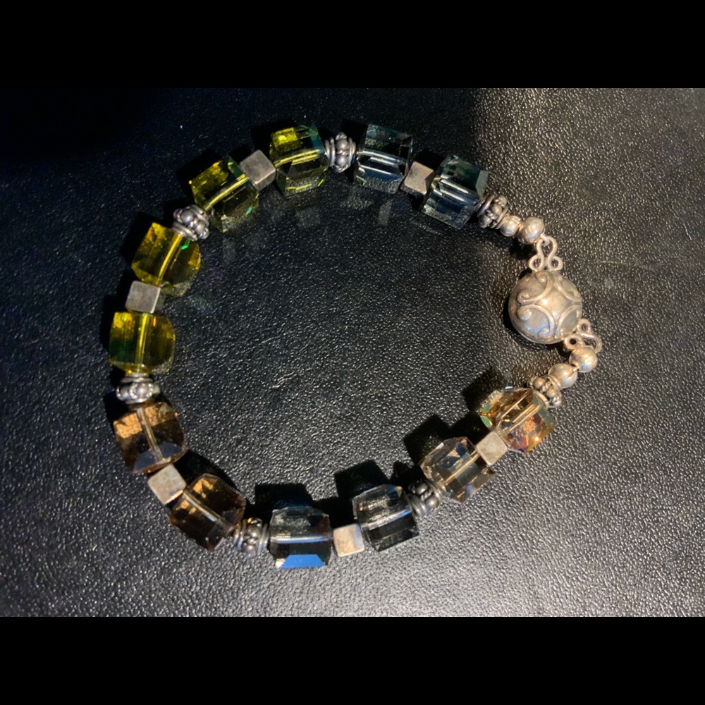 Made by local artist sterling and Swarovski